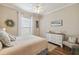 Bright bedroom with a dresser and a ceiling fan at 203 Escondido Ct, Poinciana, FL 34759