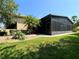 Large screened porch adjacent to the house at 203 Escondido Ct, Poinciana, FL 34759