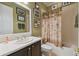 Well-appointed bathroom with shower/tub combo and dark wood vanity at 203 Escondido Ct, Poinciana, FL 34759