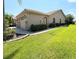 Three-car garage with a paved driveway at 203 Escondido Ct, Poinciana, FL 34759