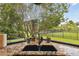 Kitchen sink with granite countertop and view of backyard at 203 Escondido Ct, Poinciana, FL 34759