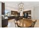 Open concept kitchen with island and breakfast nook at 203 Escondido Ct, Poinciana, FL 34759
