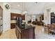 Spacious kitchen with island and views into Gathering room at 203 Escondido Ct, Poinciana, FL 34759