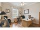 Spacious home office with wood floors and a large window at 203 Escondido Ct, Poinciana, FL 34759