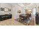 Elegant dining room with a large table, chandelier, and decorative wall art at 203 Escondido Ct, Poinciana, FL 34759