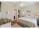 Spacious Primary bedroom with hardwood floors and ensuite bathroom at 203 Escondido Ct, Poinciana, FL 34759