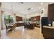 Open kitchen with island, breakfast nook, and ample cabinetry at 203 Escondido Ct, Poinciana, FL 34759