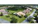 Single-Gathering home with tile roof, manicured lawn, and palm trees at 203 Escondido Ct, Poinciana, FL 34759