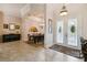 Elegant entryway with tile floors, views of dining room and french doors at 203 Escondido Ct, Poinciana, FL 34759