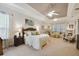 Main bedroom with sitting area and large windows at 203 Escondido Ct, Poinciana, FL 34759