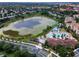 Aerial view of community pool and lake at 7671 Comrow St # 202, Kissimmee, FL 34747