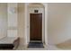 Private condo entry with security keypad and bench at 7671 Comrow St # 202, Kissimmee, FL 34747
