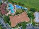 Aerial view of community pool, water park, and residential buildings at 7671 Comrow St # 202, Kissimmee, FL 34747
