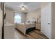 Bright bedroom with queen bed, neutral decor, and plenty of closet space at 7671 Comrow St # 202, Kissimmee, FL 34747