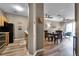 Open concept living and dining area with wood-look flooring at 7671 Comrow St # 202, Kissimmee, FL 34747