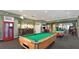 Community game room with pool tables and arcade games at 7671 Comrow St # 202, Kissimmee, FL 34747