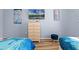 Bedroom with twin beds, Frozen bedding, and dresser at 7671 Comrow St # 202, Kissimmee, FL 34747