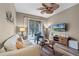 Living room with comfy seating, large TV, and access to balcony at 7671 Comrow St # 202, Kissimmee, FL 34747