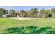 Community sand volleyball court with surrounding green space at 7671 Comrow St # 202, Kissimmee, FL 34747