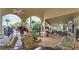 Community patio area with seating, landscaping, and views of the pool at 7671 Comrow St # 202, Kissimmee, FL 34747