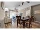 Open living room featuring hardwood floors, comfy seating, and access to balcony at 7671 Comrow St # 202, Kissimmee, FL 34747