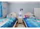 Bedroom with twin beds, Frozen bedding, and nightstand at 7671 Comrow St # 202, Kissimmee, FL 34747