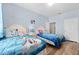 Bedroom with twin beds, Frozen bedding, and closet at 7671 Comrow St # 202, Kissimmee, FL 34747