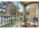 Relaxing screened balcony with patio furniture and views of the community at 7671 Comrow St # 202, Kissimmee, FL 34747