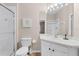 Bathroom features a vanity, toilet and shower at 7671 Comrow St # 202, Kissimmee, FL 34747