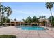 Inviting community pool with ample lounge chairs and shade structures at 501 Mirasol Cir # 424, Celebration, FL 34747