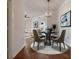 Dining area with table, chairs, hardwood floors at 501 Mirasol Cir # 424, Celebration, FL 34747