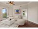 Living room featuring hardwood floors, a white couch, and access to a balcony at 501 Mirasol Cir # 424, Celebration, FL 34747