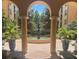 Tranquil courtyard featuring a central fountain and lush landscaping at 501 Mirasol Cir # 424, Celebration, FL 34747