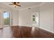 Spacious living room with hardwood floors, access to a balcony, and lots of natural light at 501 Mirasol Cir # 424, Celebration, FL 34747