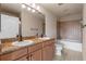 Bathroom with double vanity, tub and shower at 501 Mirasol Cir # 424, Celebration, FL 34747