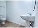 Simple bathroom with pedestal sink and tile floors at 10091 Austrina Oak Loop, Winter Garden, FL 34787
