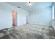 Bedroom with carpeted floors and access to bathroom and closet at 10091 Austrina Oak Loop, Winter Garden, FL 34787
