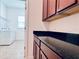 Laundry room with washer, dryer, and granite countertop at 10091 Austrina Oak Loop, Winter Garden, FL 34787
