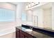 Bathroom with soaking tub, granite countertop, and walk-in shower at 10091 Austrina Oak Loop, Winter Garden, FL 34787