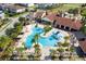 Community pool with expansive deck and surrounding landscaping at 10091 Austrina Oak Loop, Winter Garden, FL 34787