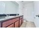 Double vanity bathroom with granite countertops at 10091 Austrina Oak Loop, Winter Garden, FL 34787