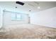 Large bedroom with carpeted floors and multiple windows at 10091 Austrina Oak Loop, Winter Garden, FL 34787