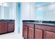 Double vanity bathroom with granite countertops at 10091 Austrina Oak Loop, Winter Garden, FL 34787