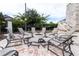 Community fire pit with surrounding seating at 10091 Austrina Oak Loop, Winter Garden, FL 34787