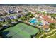 Aerial view of community with pool and tennis courts at 10091 Austrina Oak Loop, Winter Garden, FL 34787