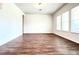 Large living room with wood-look floors and lots of natural light at 10091 Austrina Oak Loop, Winter Garden, FL 34787