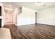 Open living room with stairs and wood-look floors at 10091 Austrina Oak Loop, Winter Garden, FL 34787