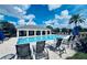 Relaxing resort-style pool with lounge chairs at 10091 Austrina Oak Loop, Winter Garden, FL 34787
