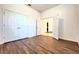 Spacious bedroom with wood-look floors and access to other rooms at 10091 Austrina Oak Loop, Winter Garden, FL 34787