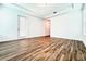 Bright bedroom with wood-look floors and sliding glass door at 10091 Austrina Oak Loop, Winter Garden, FL 34787